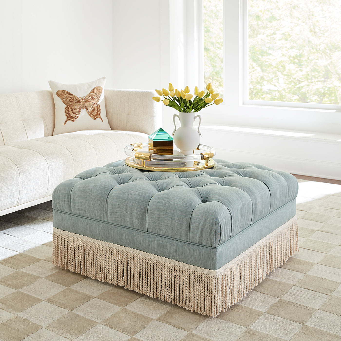 muse butterfly throw pillow baxter ottoman with bullion fringe - styled view