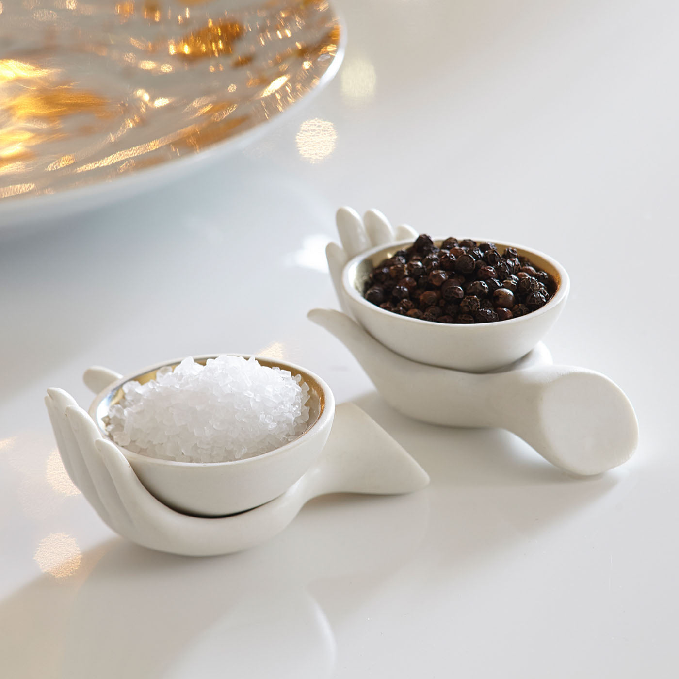 eve salt and pepper cellars porcelain white interior gold - styled view