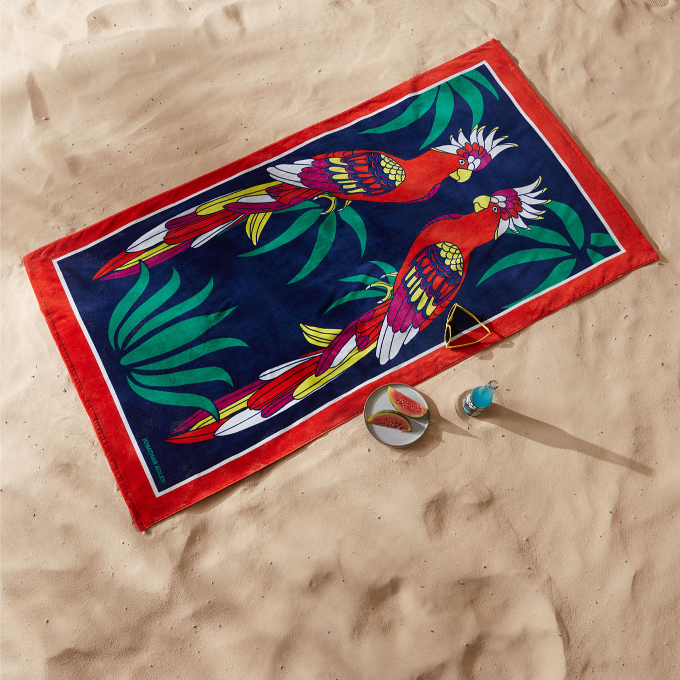 Parrots Beach Towel - style shot with sand