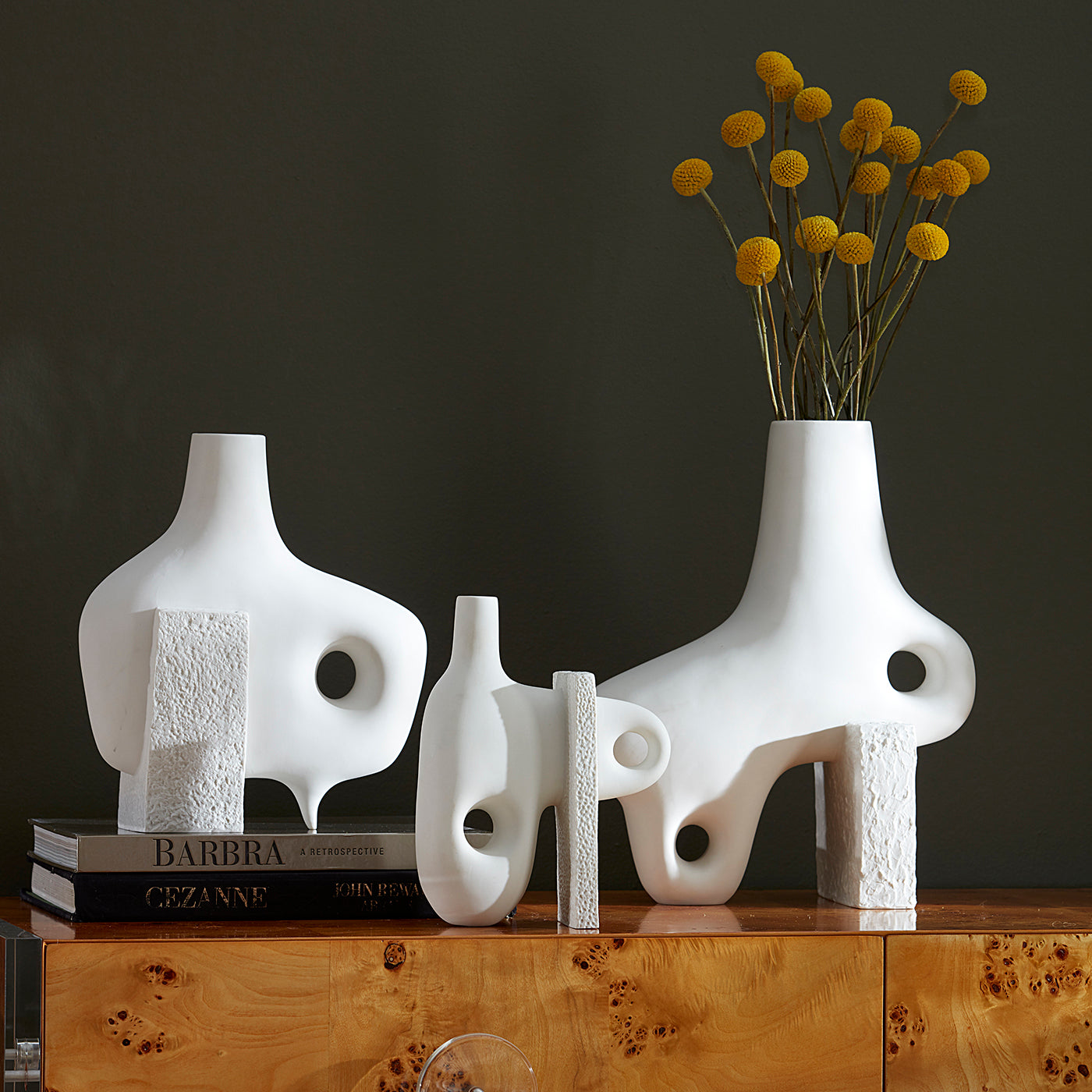 paradox vases with flowers stacked books vignette - styled view