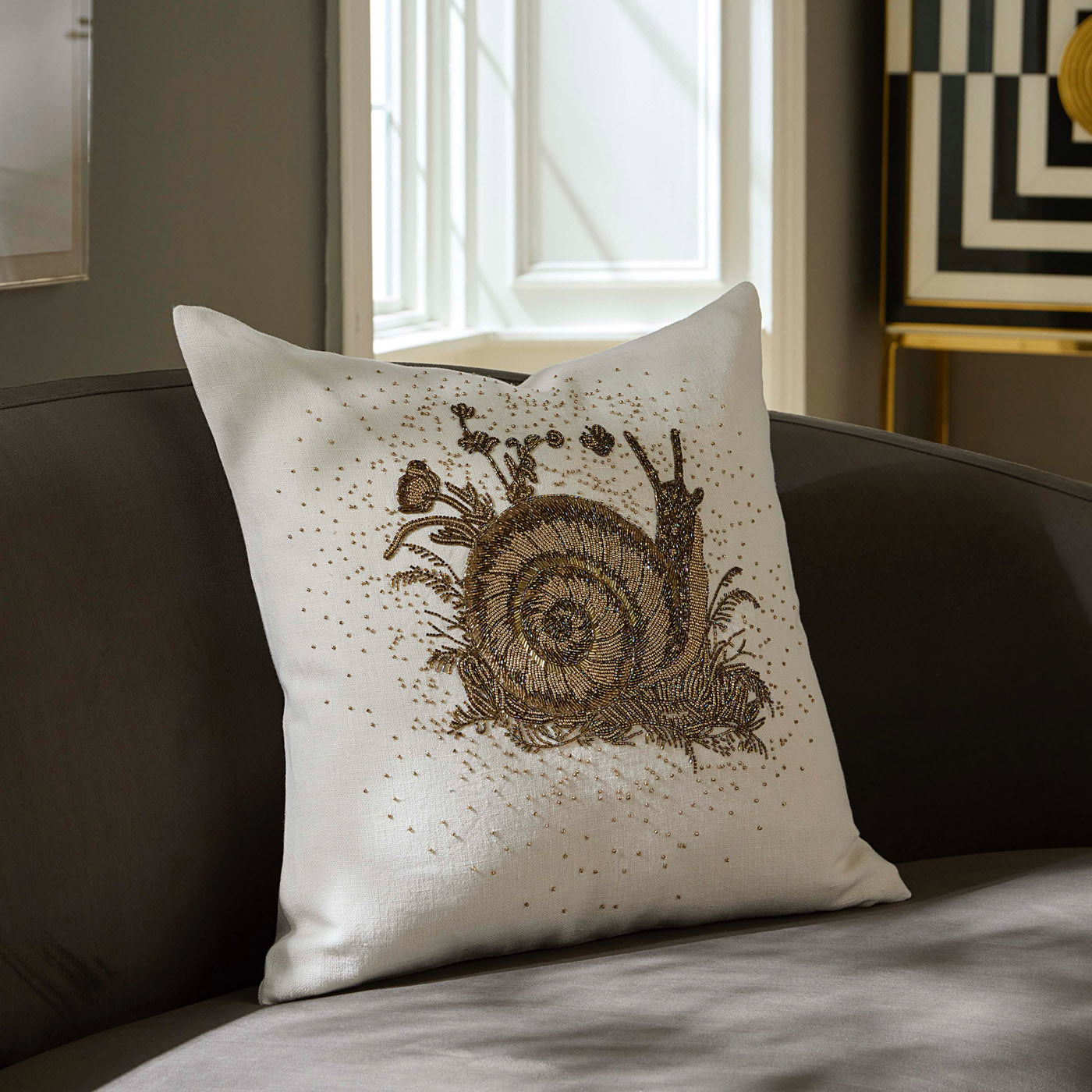 Botanist Snail Beaded Pillow - styled view