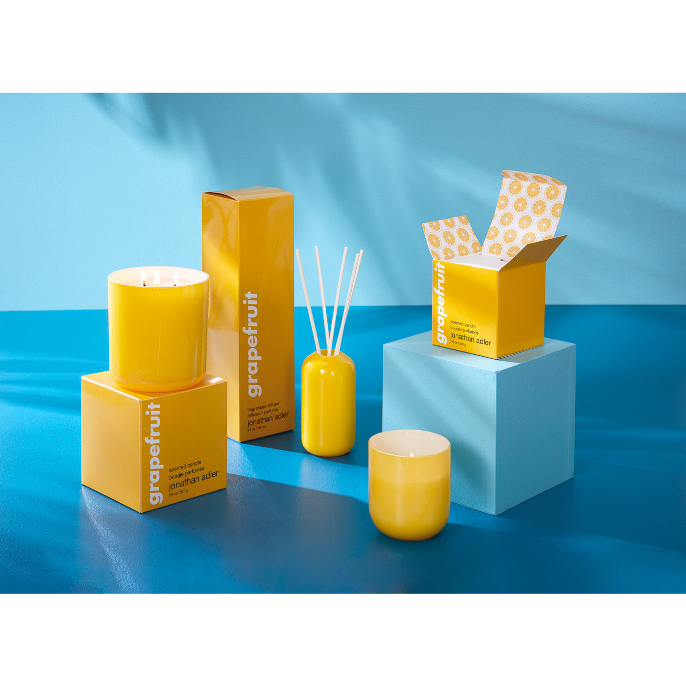 grapefruit pop collection with candles and diffuser - styled view