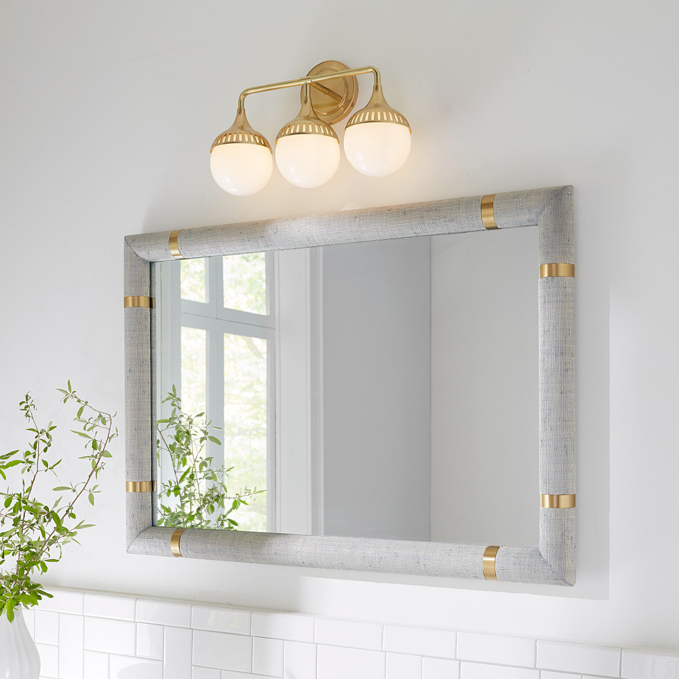 rio three light sconce brass siam mirror - styled view
