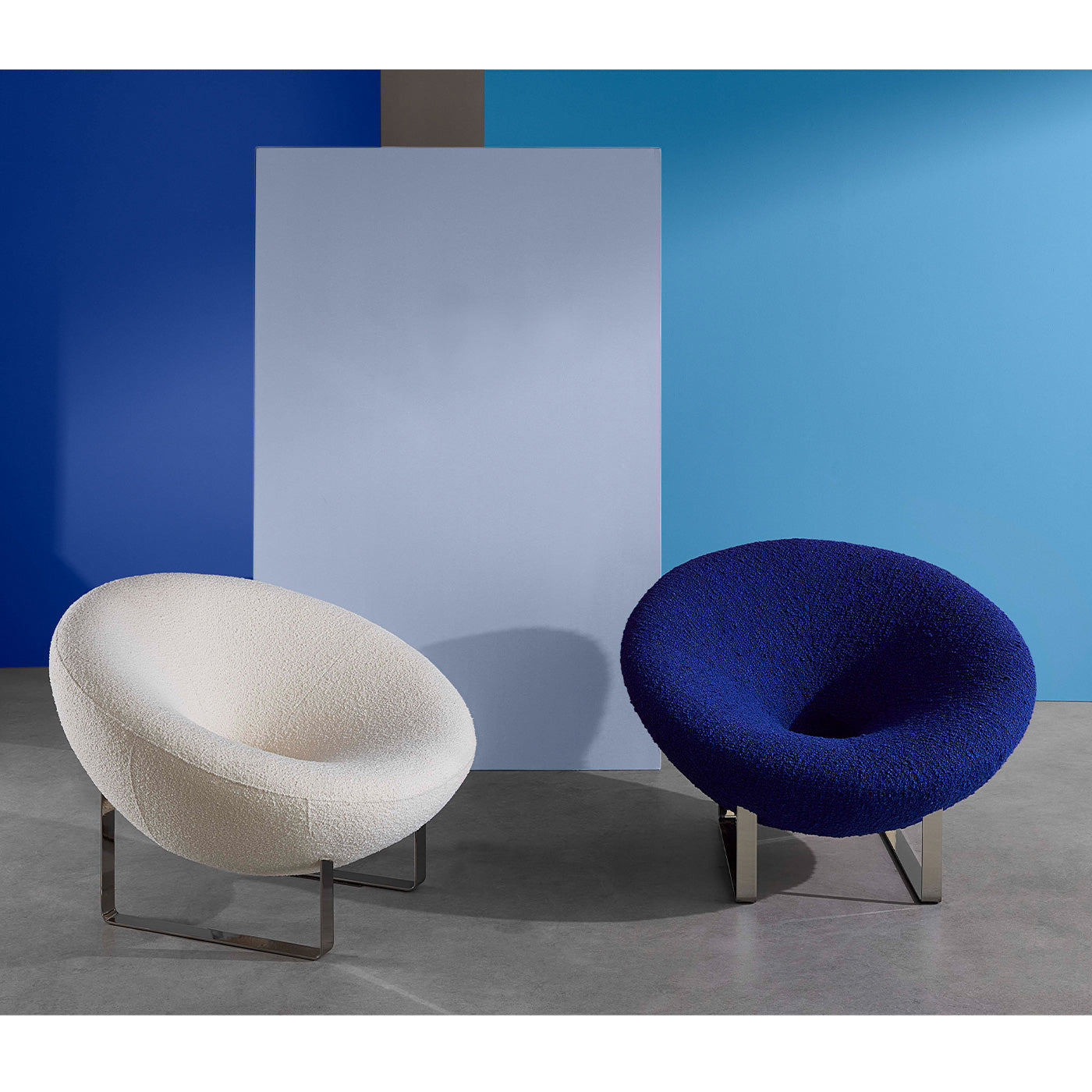 Saturn Lounge Chairs with blue background styled view