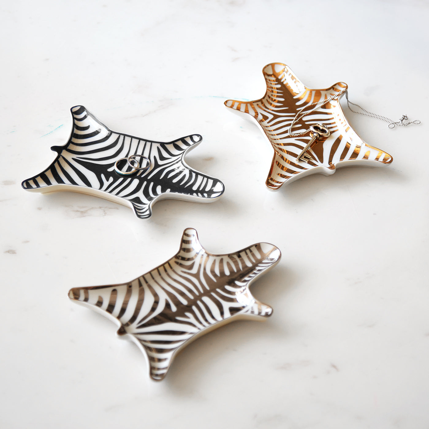 zebra stacking dish collection green background - styled view