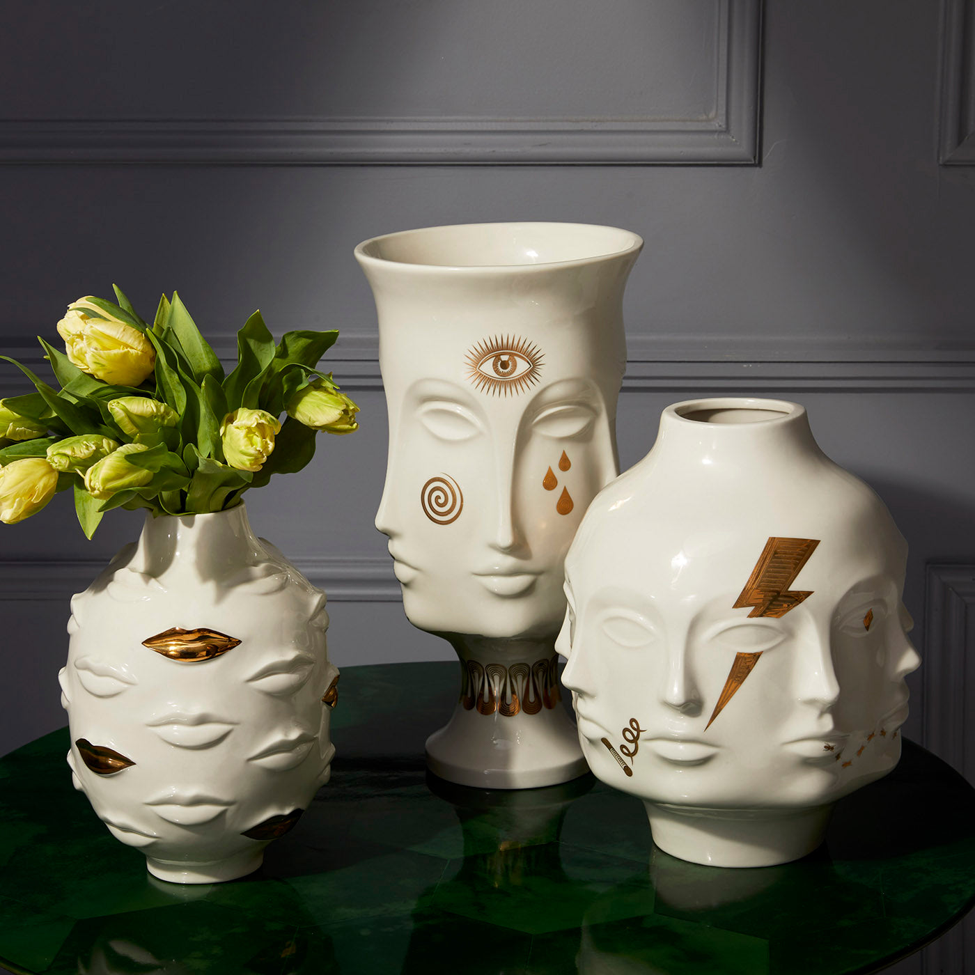 gilded muse vase collection with tulips - styled view