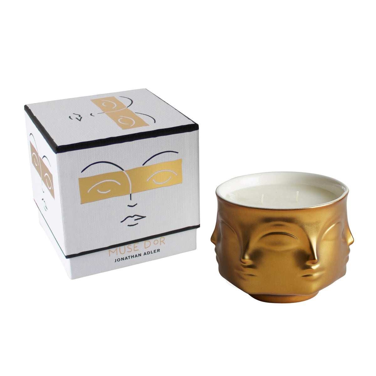 porcelain candle with gold exterior; two wick; face shaped with box