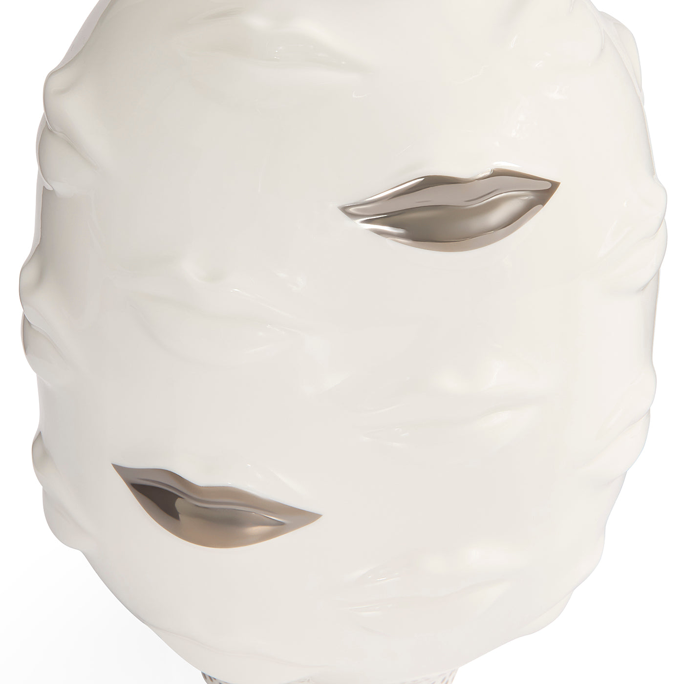 A glossy white ceramic decorative mask shaped like a face with two metallic silver lips cutouts, shown on a plain white background.