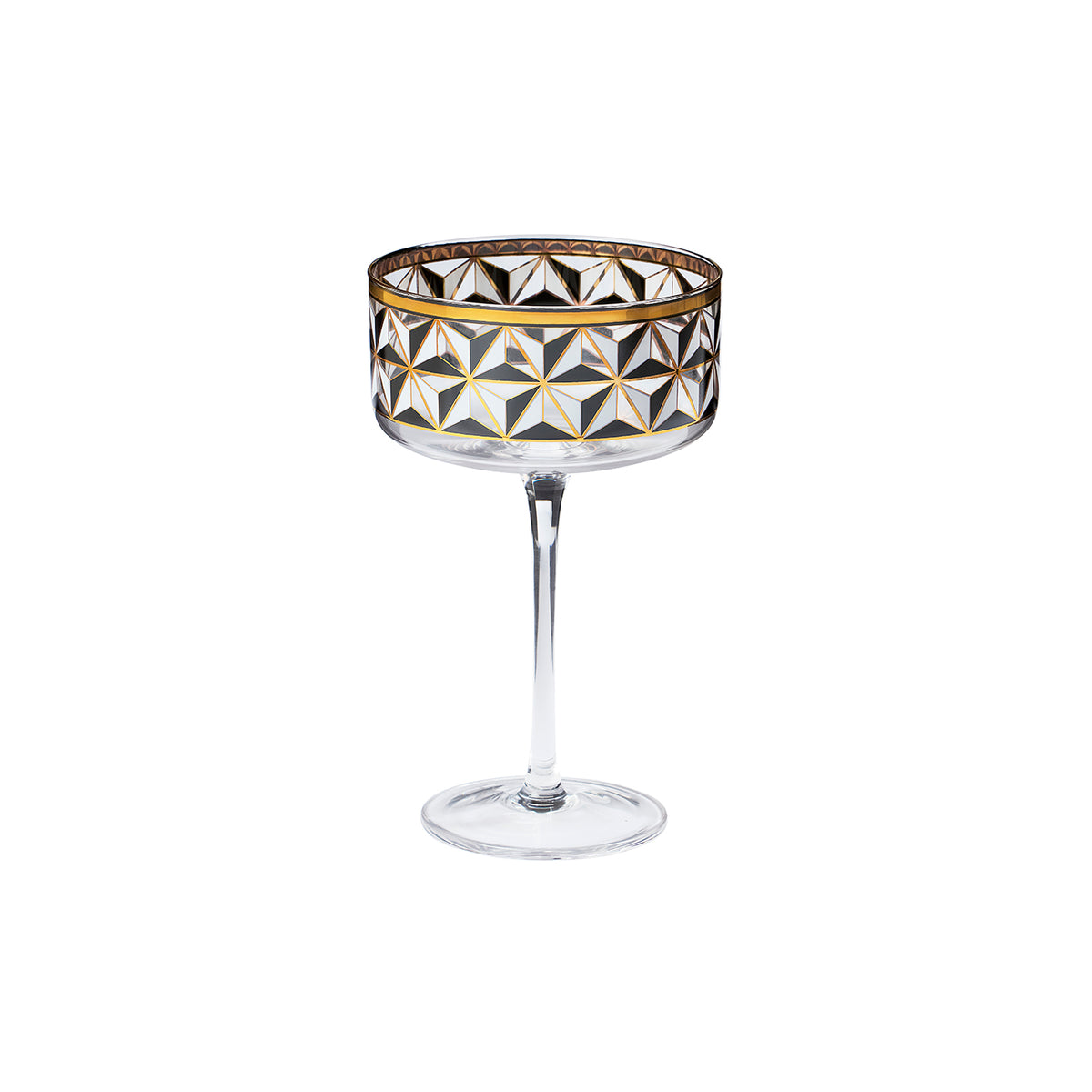 A clear stemmed coupe glass with a geometric faceted pattern in black, white, and gold on the bowl, set against a plain white background.