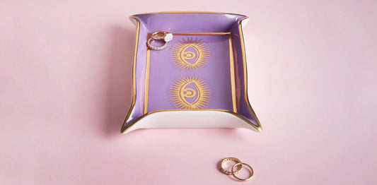 Purple Trinket Tray with Gold Eyes Detail Styled Shot with Rings