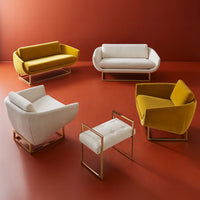 Modern furniture set with yellow and white sofas and chairs on a red floor.