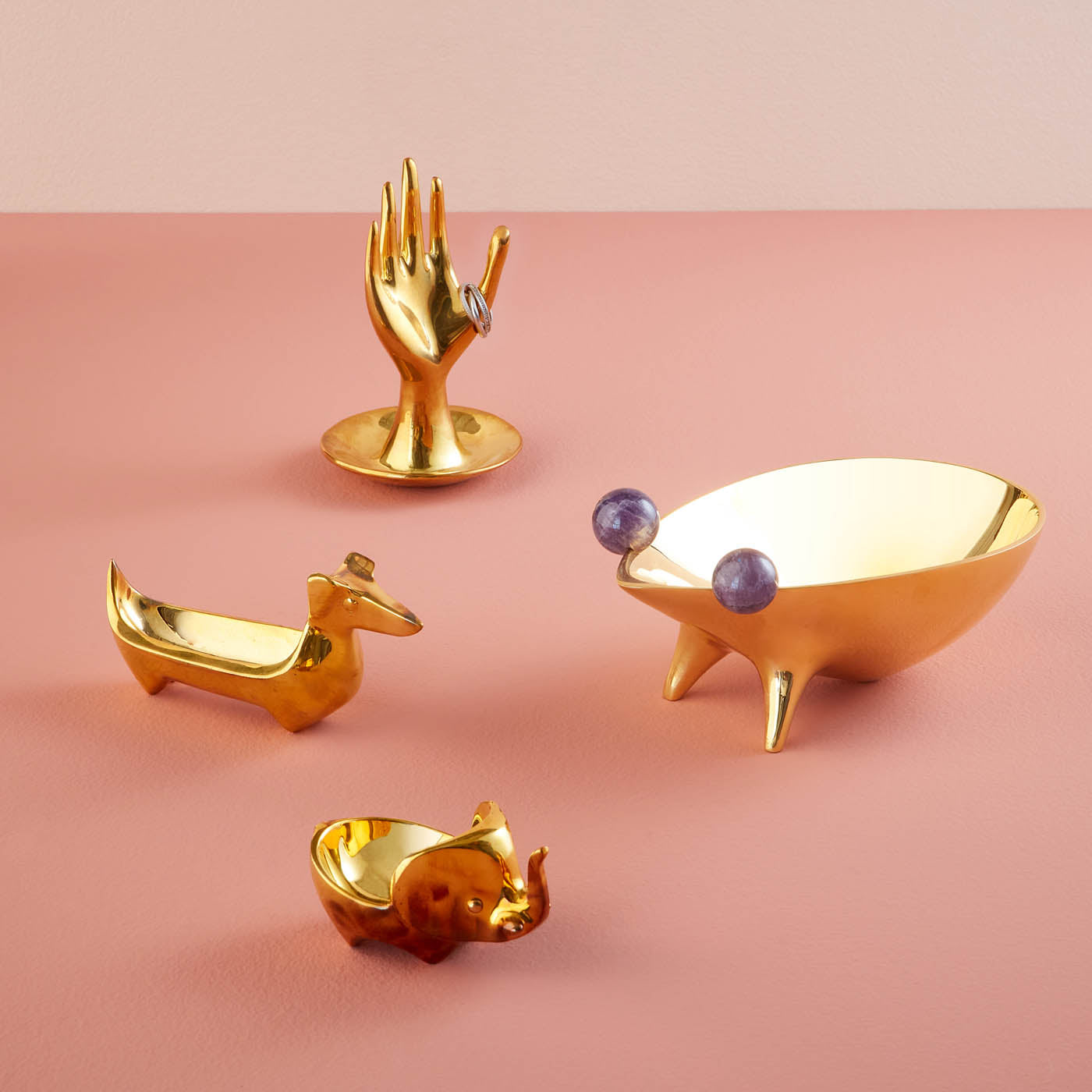 brass hand collection purple blue background holiday - styled view