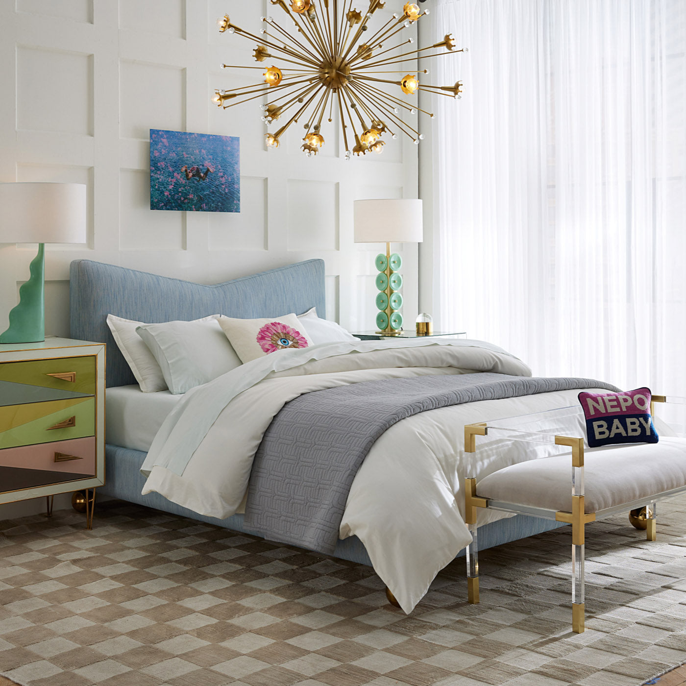 Modern bedroom with a bed, nightstands, and decorative elements.