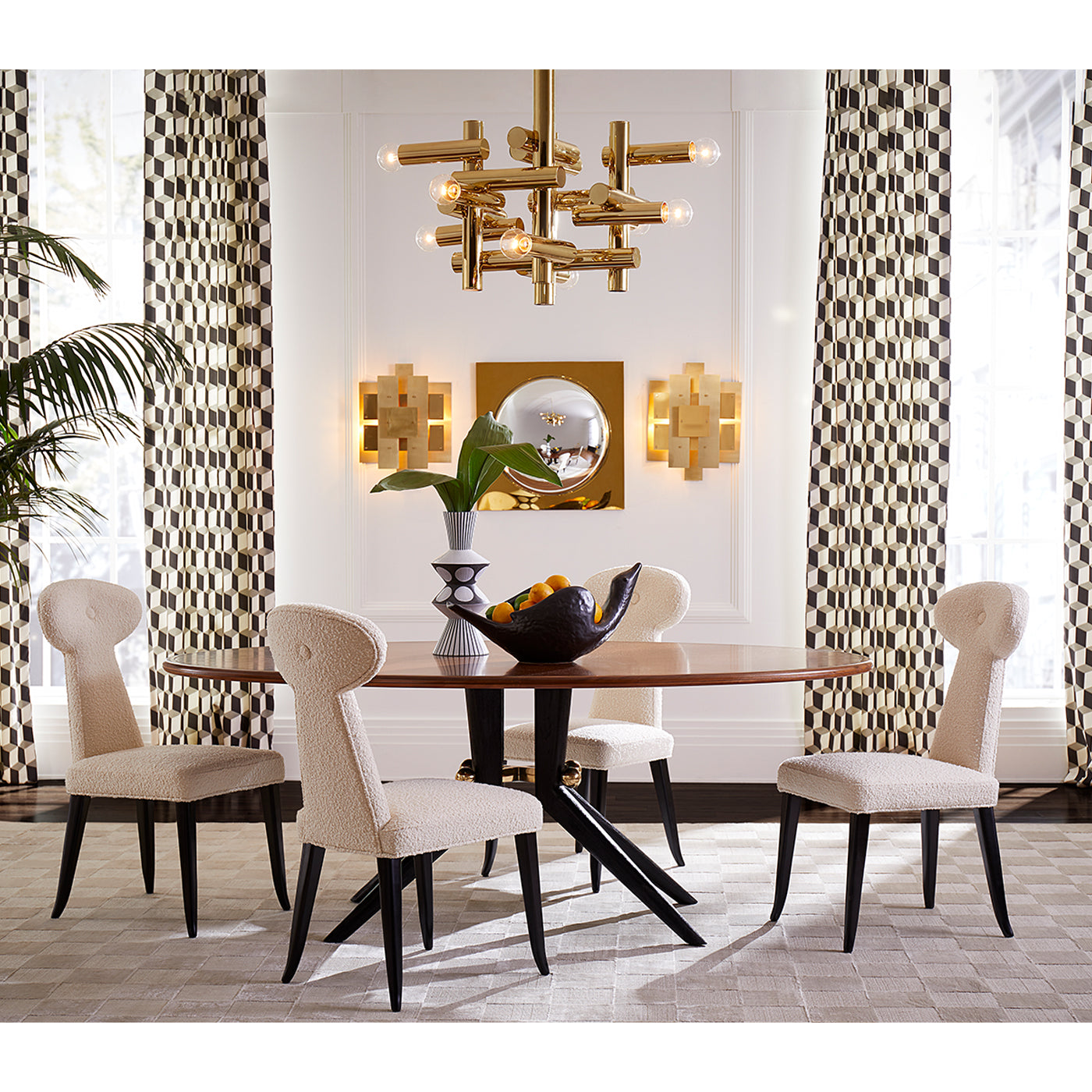 milano kinetic chandelier brass parker curved sofa ripple round travertine cocktail table talitha mirror living room - styled view