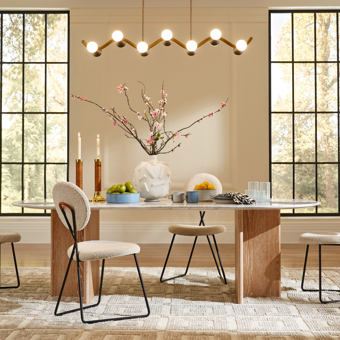 brussles t base dining table caprice dining chairs caracas wave chandelier saint germain hand knotted rug - styled view