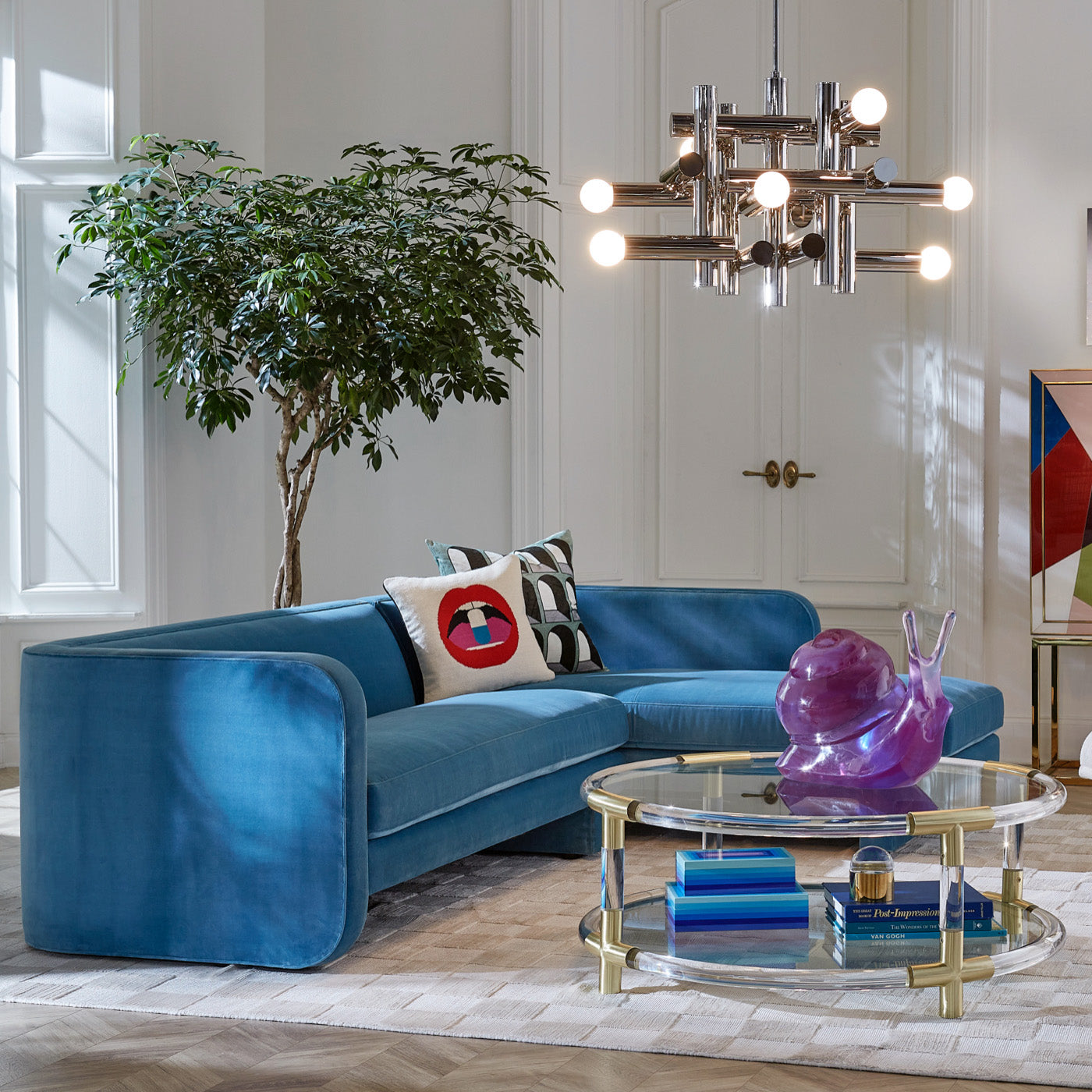 jacques round cocktail table ether curved sofa small squares hand knotted rug - styled view