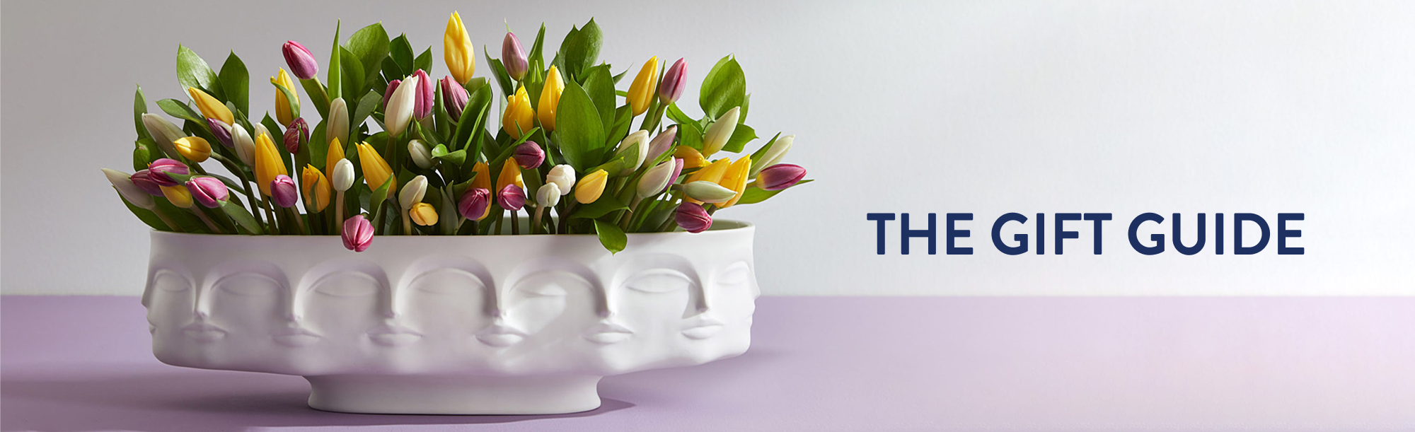 Gift Guide text over long bowl with flowers