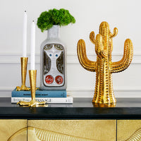 glass menagerie lady vase brass cactus brass talon candle holders vignette - styled view