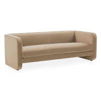 A modern low-profile sofa upholstered in a warm taupe-beige fabric, shown from a three-quarters angle against a plain white background.