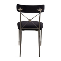 Black chair with decorative metal backrest on a white background