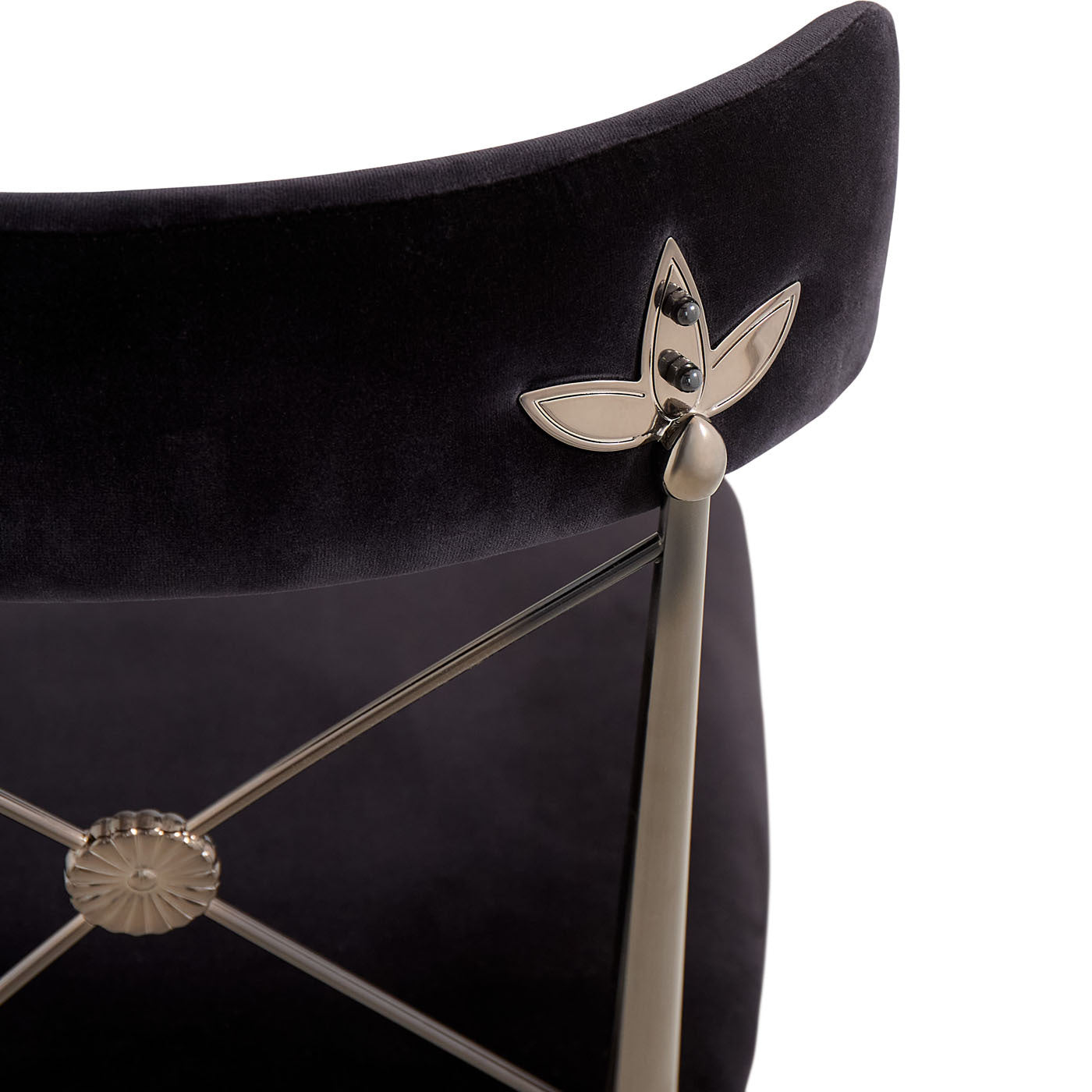 Black chair with silver decorative elements on a white background