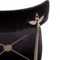 Black chair with silver decorative elements on a white background