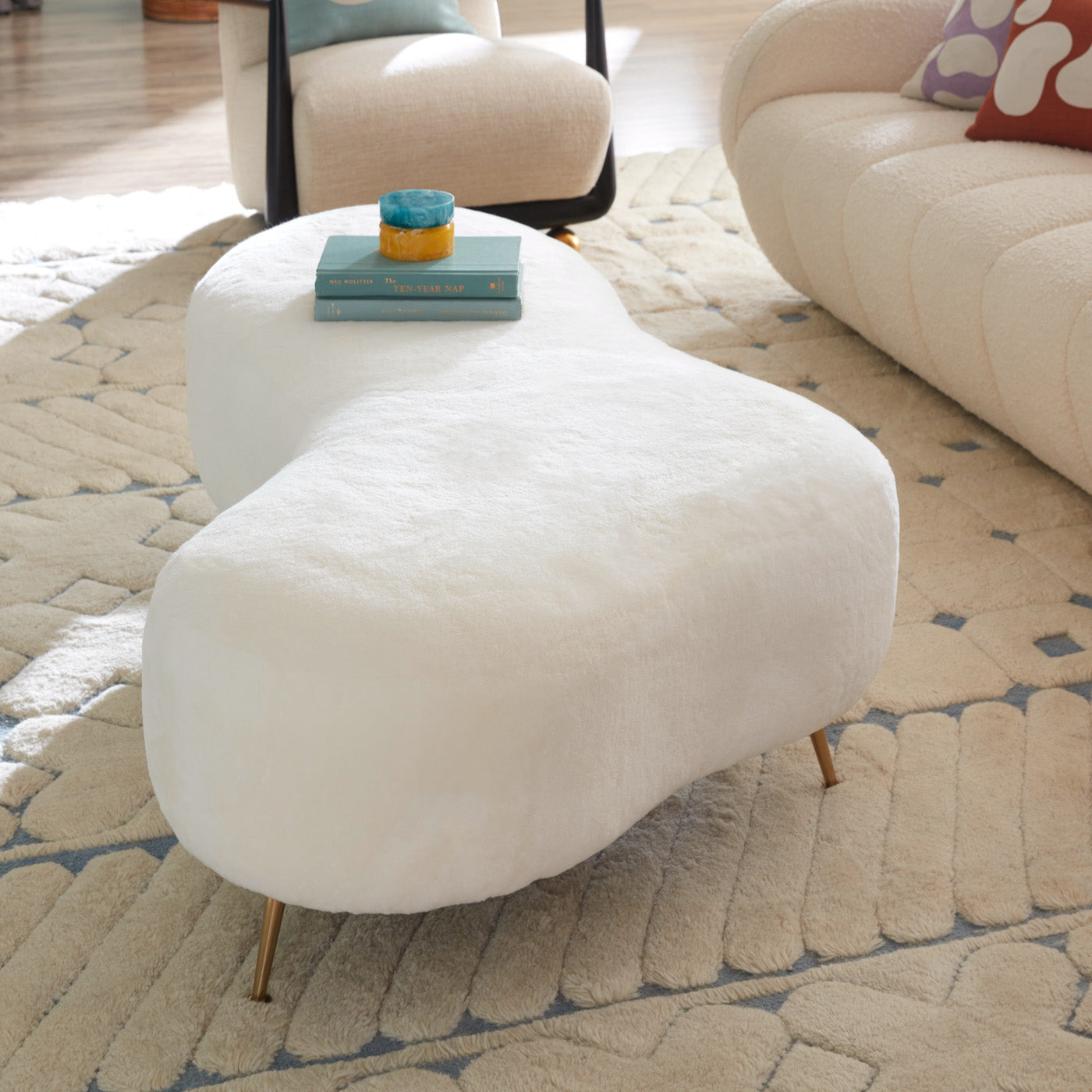 amorphic cocktail ottoman shearling white brass feet - side view