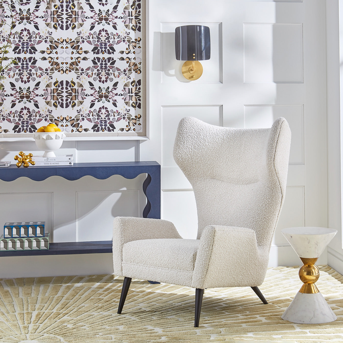 polly sconce milano wing chair flow leather console - styled view