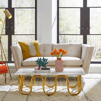 sebastain apartment sofa scalinatella rectangular cocktail table channeled goldfinger chair - styled view