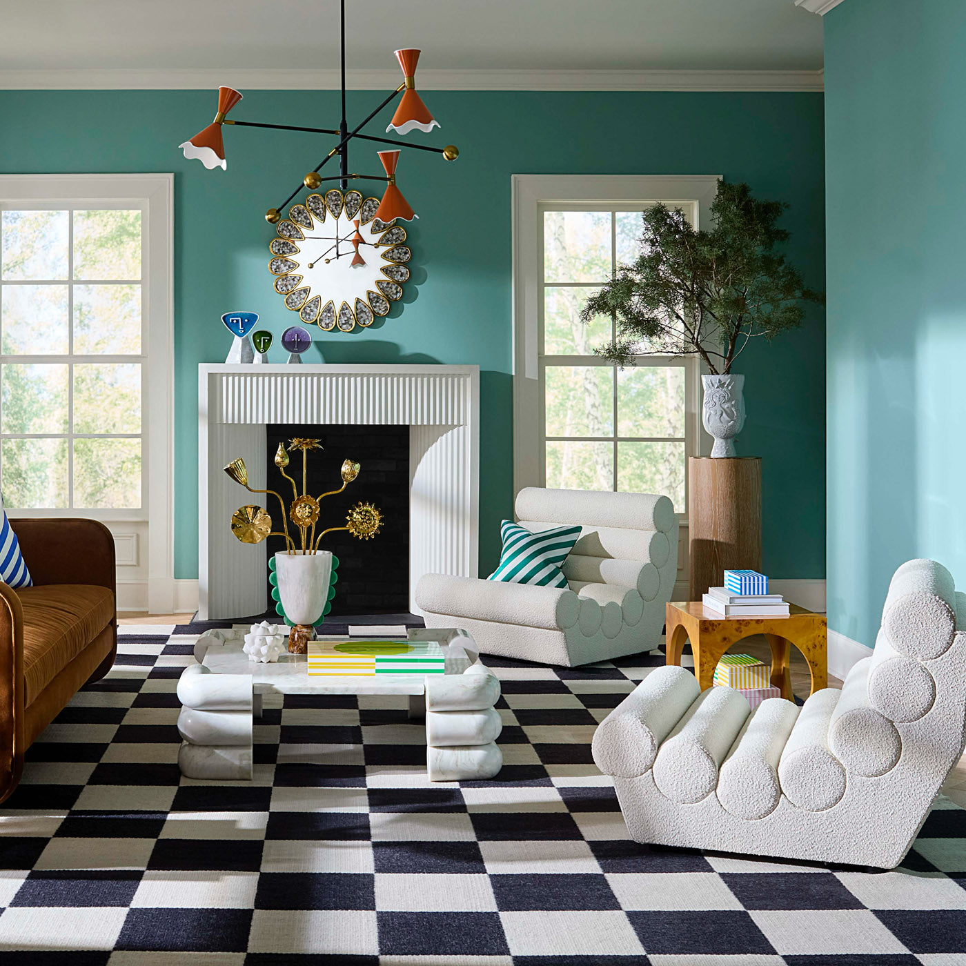 Ripple Articulating Chandelier with Futura Sofa