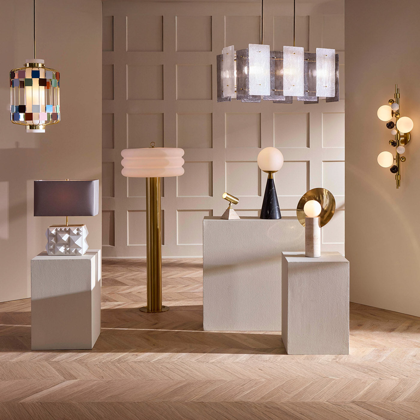 Modern interior with various lamps and decorative items on a wooden floor.