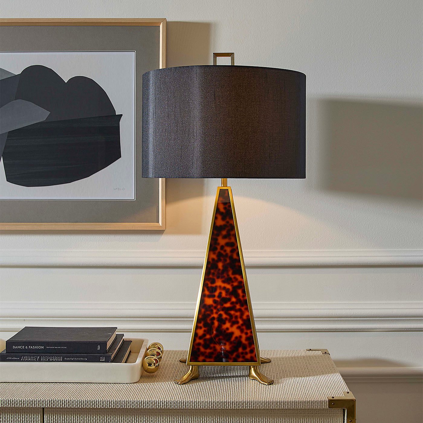 Decorative table lamp with a leopard print base on a side table.
