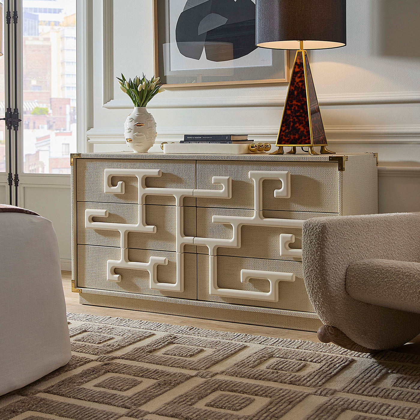 Decorative chest of drawers with geometric patterns in a stylish room.