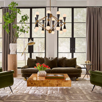 Modern living room with brown sofa, wooden coffee table, and decorative elements.