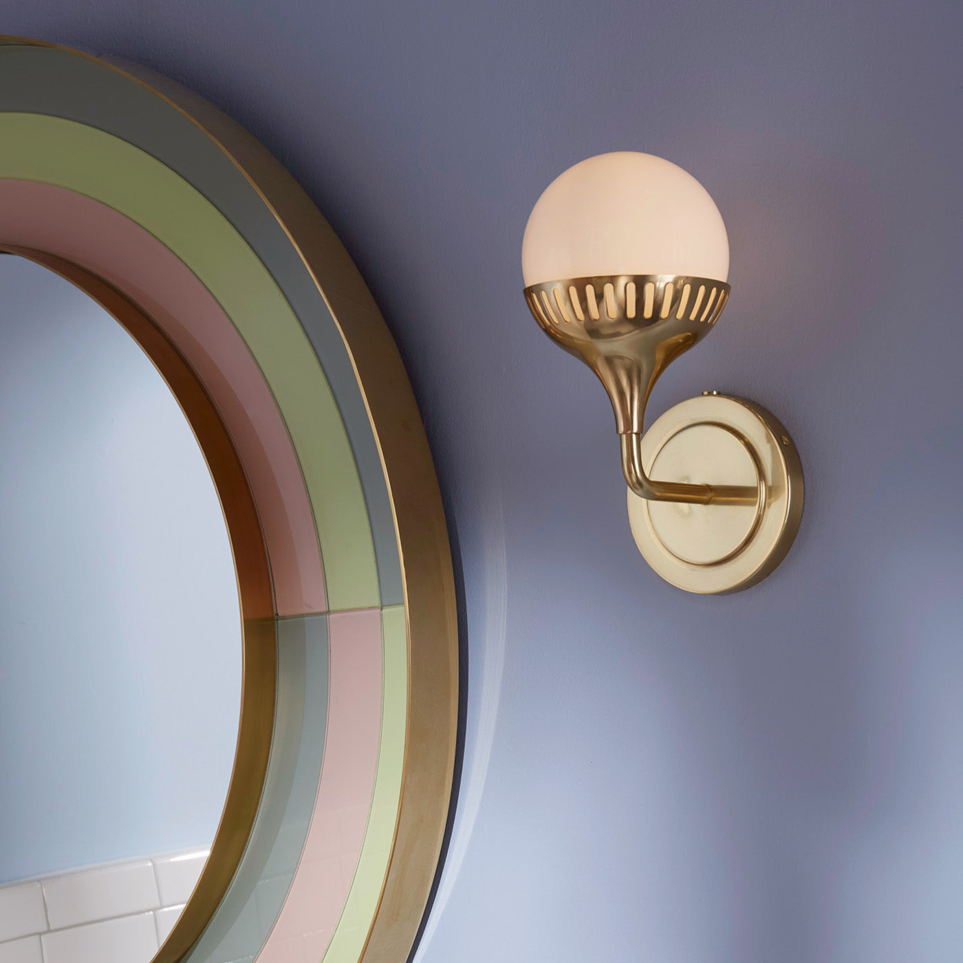 rio single sconce brass harlequin round mirror - styled view