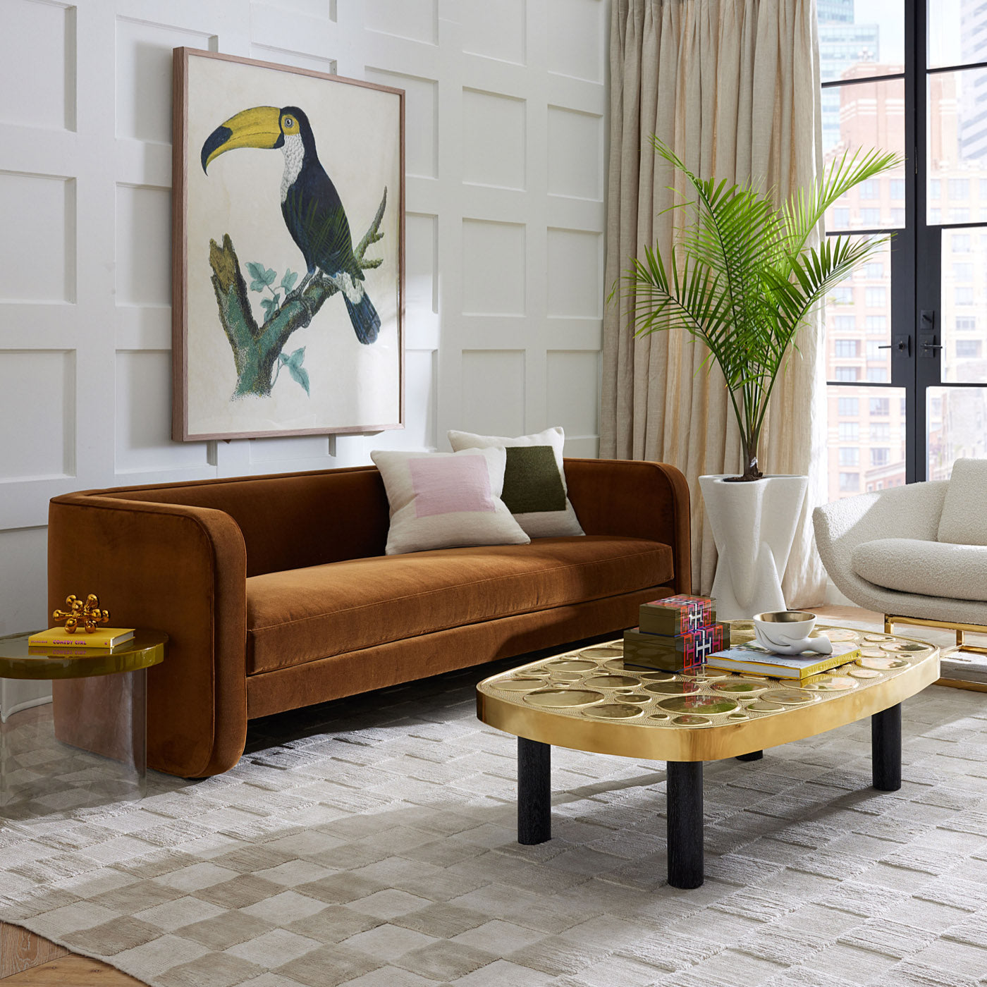 Modern living room with brown sofa, wooden coffee table, and decorative elements.