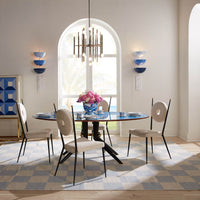 large scale checkerboard flat weave rug with goldfinger chair