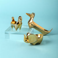 brass ring bowl collection blue background - styled view