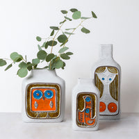 glass menagerie vase collection with eucalyptus - styled view