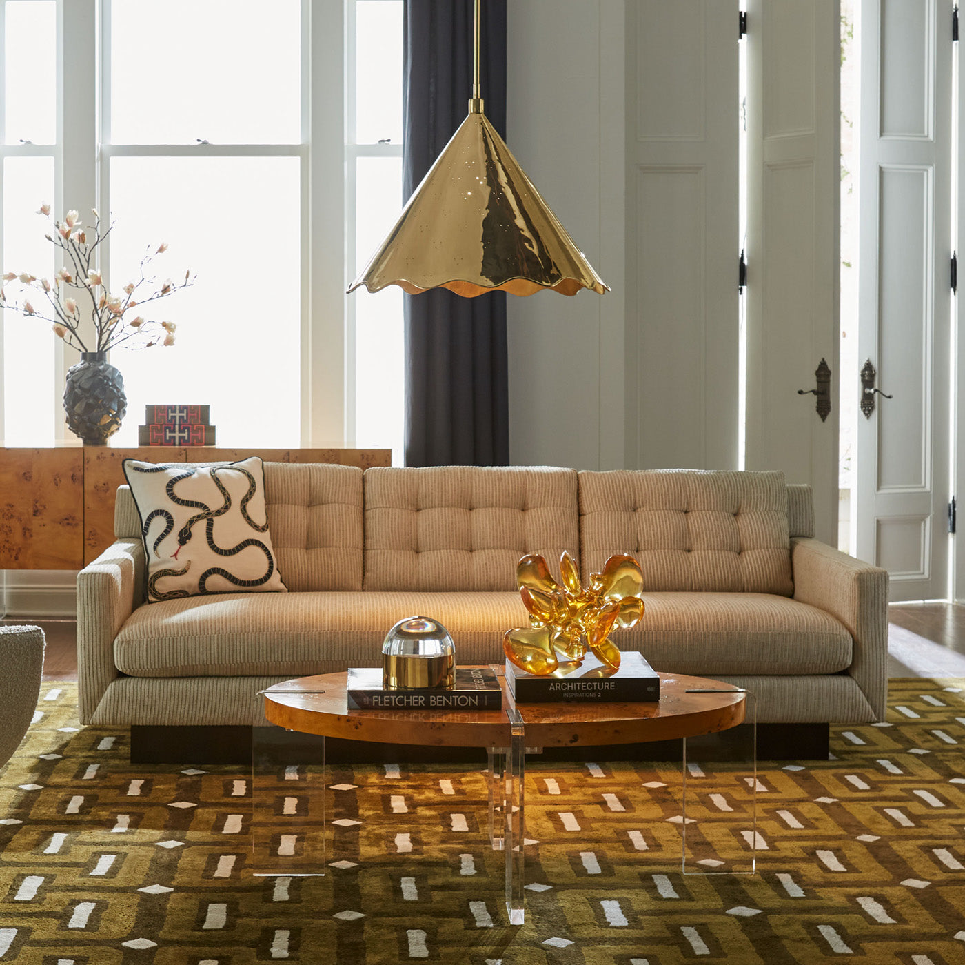 large brass ripple pendant with caprice dining chair