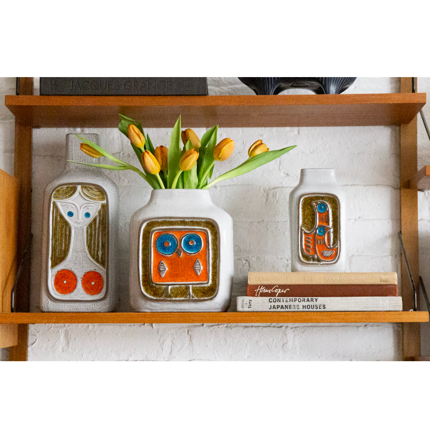 glass menagerie vase collection with tulips - styled view