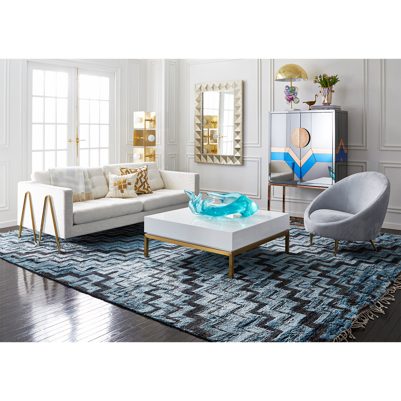 talitha mirror maxime sofa peking cocktail table ether chair - styled view