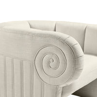 Close-up of a beige upholstered chair with decorative stitching on a white background