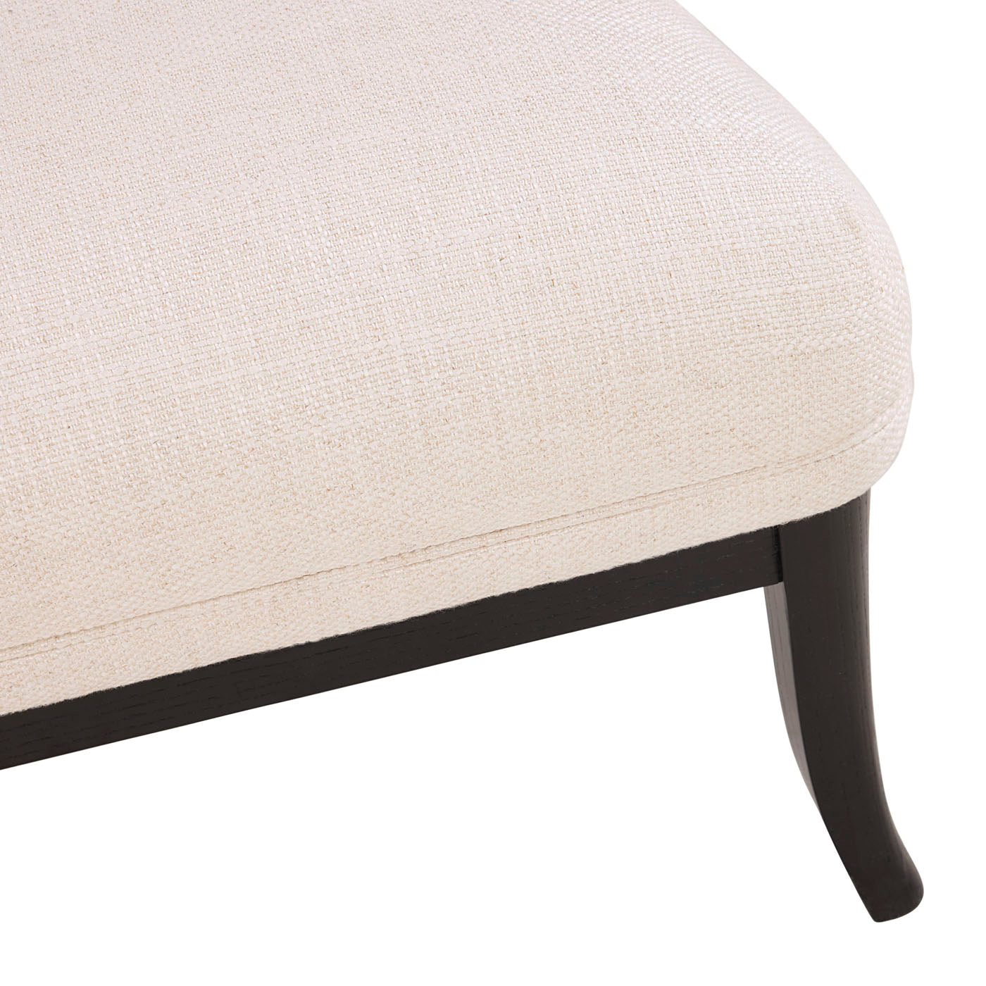 Close-up of a beige upholstered chair with dark wooden legs on a white background