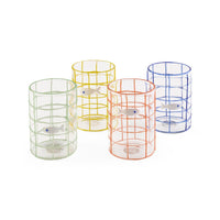 Four colorful glass tumblers with fish designs on a white background
