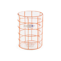 Clear glass vase with copper wire cage on a white background