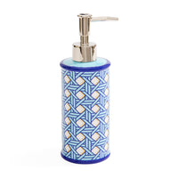 A cylindrical soap dispenser with a blue and white geometric patterned body, a light blue top, and a polished silver pump dispenser.
