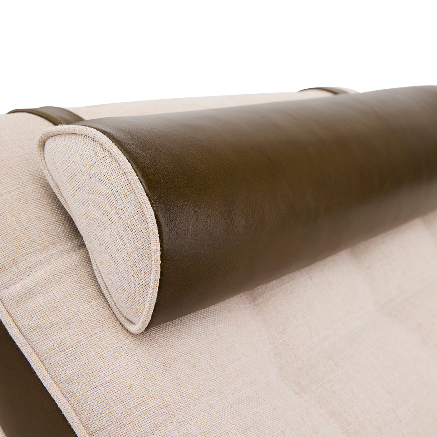 Close-up of a roll of brown leather and beige fabric on a white background