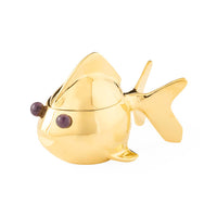 Gold fish-shaped object on a white background