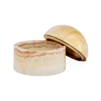 Decorative box with marble-like surface and gold lid on a white background